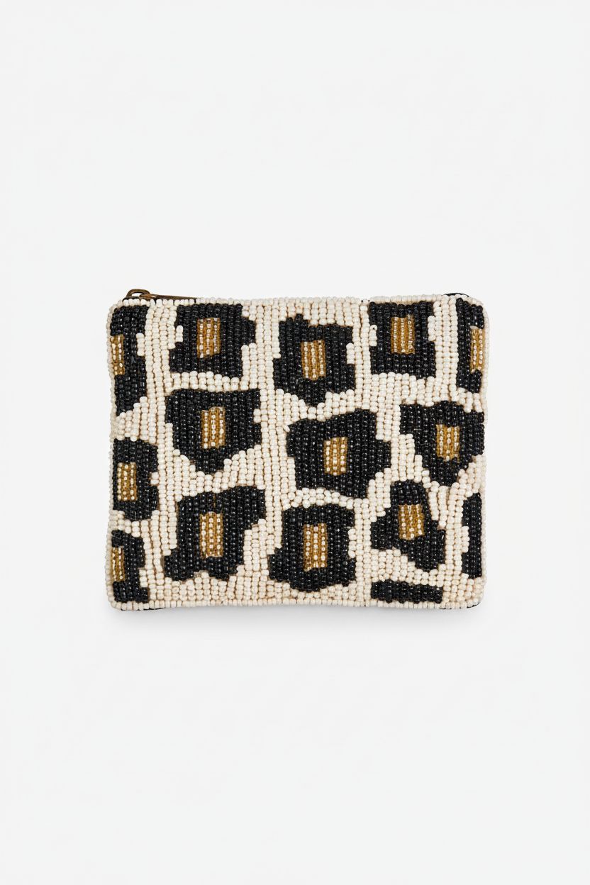 Close-up of Bamboo Trading leopard coin purse showcasing beadwork and zipper.