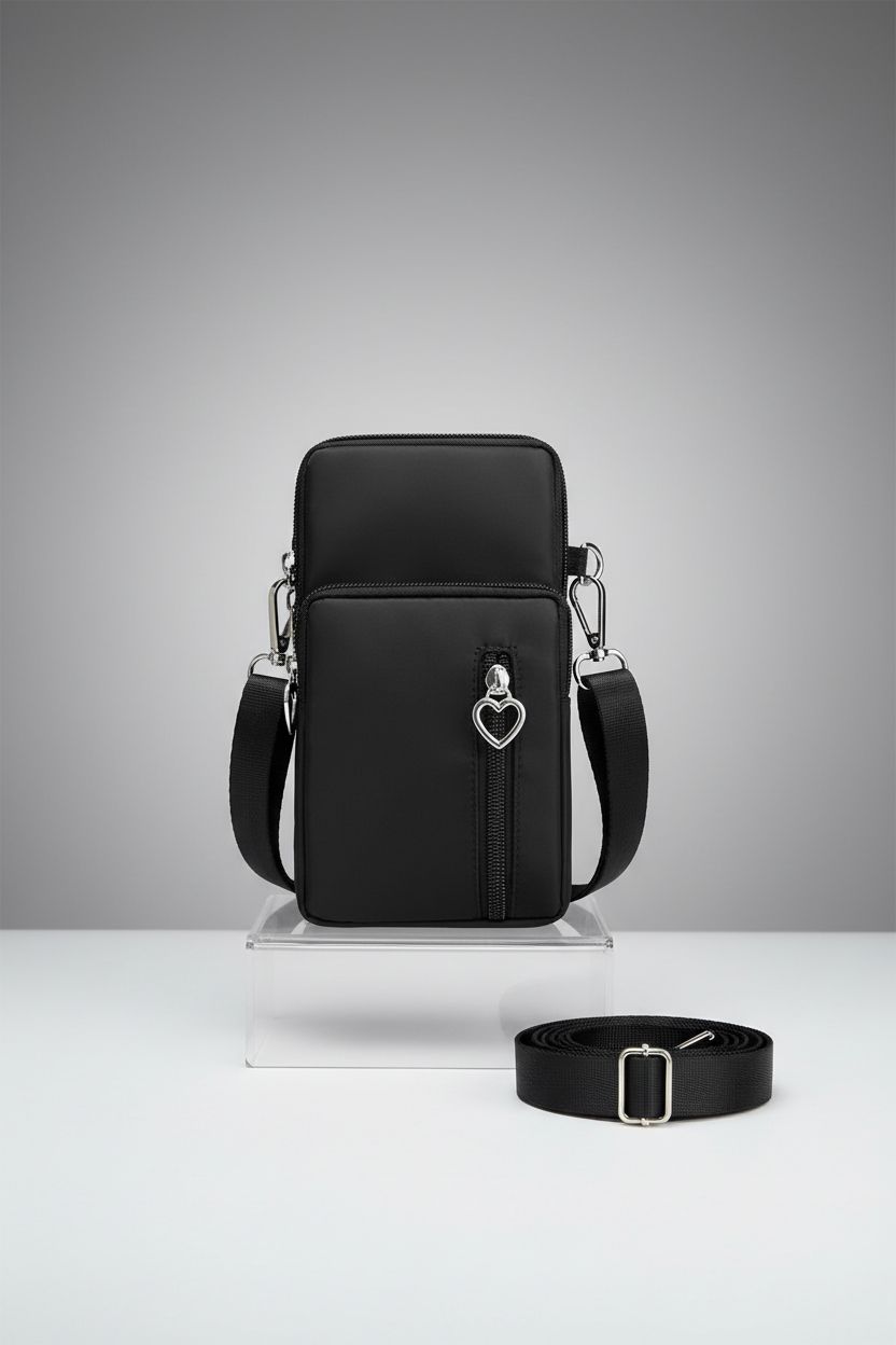 Product shot of JANKS small crossbody bag on a studio set, showcasing its sleek nylon design and features.