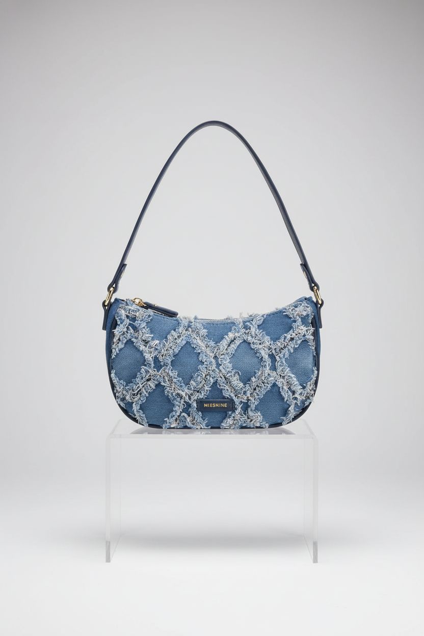 Close-up of Missnine denim mini hobo bag emphasizing its quality and design features.