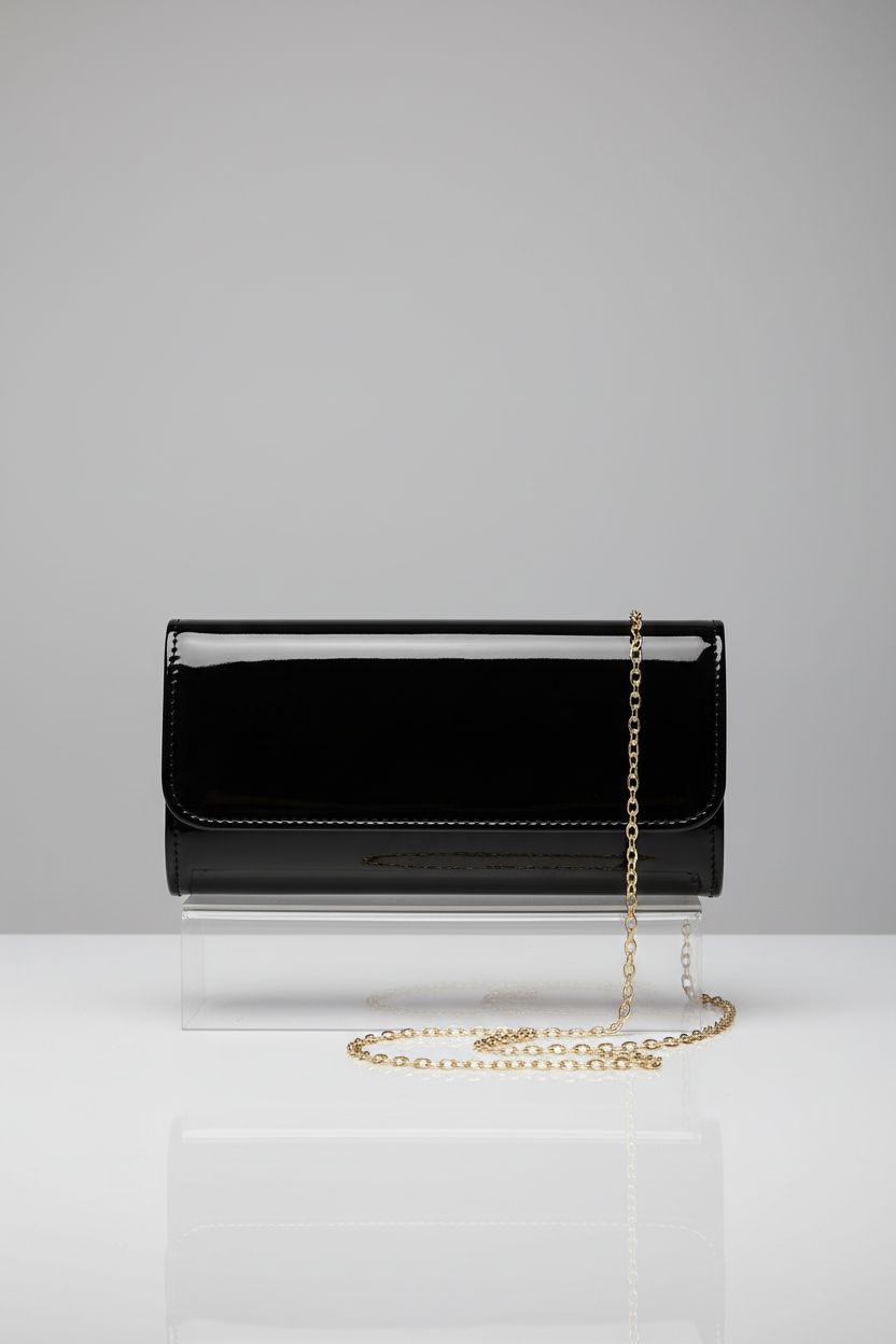 DETARA patent leather purse showcasing its sleek design and gold chain.