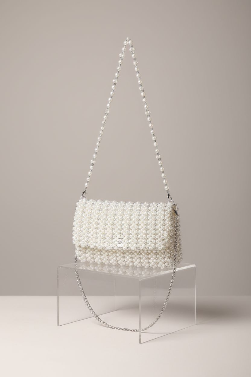 CHIC DIARY pearl shoulder bag displayed in clean studio, highlighting its exquisite pearl detailing.