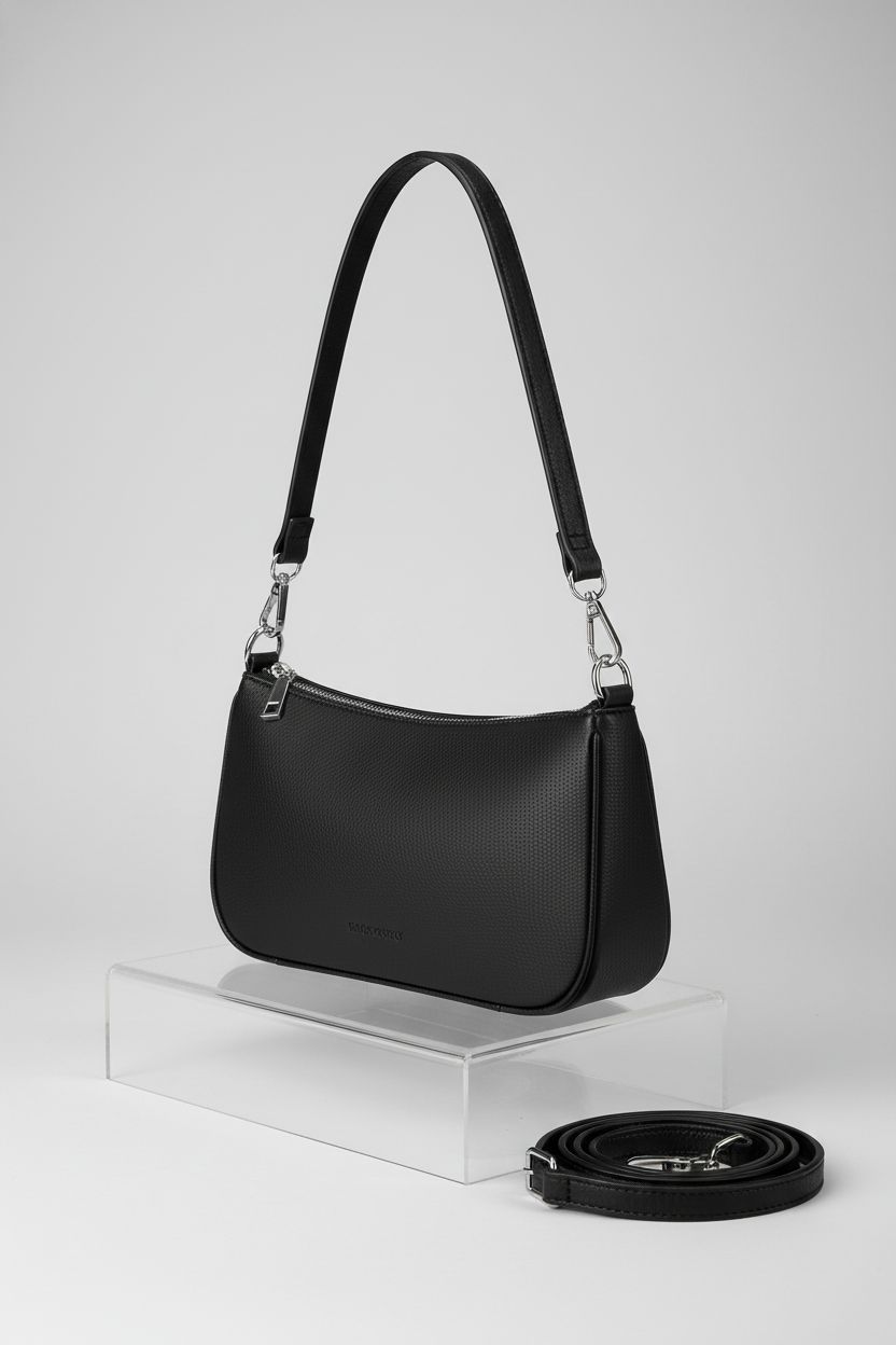 NIUEIMEE ZHOU small clutch purse with polished silver hardware on a clean studio backdrop.