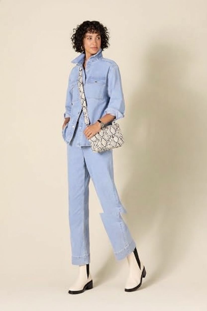 Amazon Essentials snake print crossbody bag showcased on a clean studio set highlighting its design.