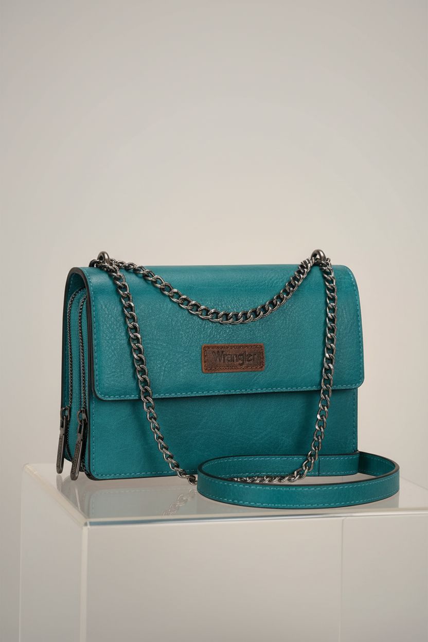 Detailed view of Wrangler turquoise bag showcasing pebbled finish and stitching