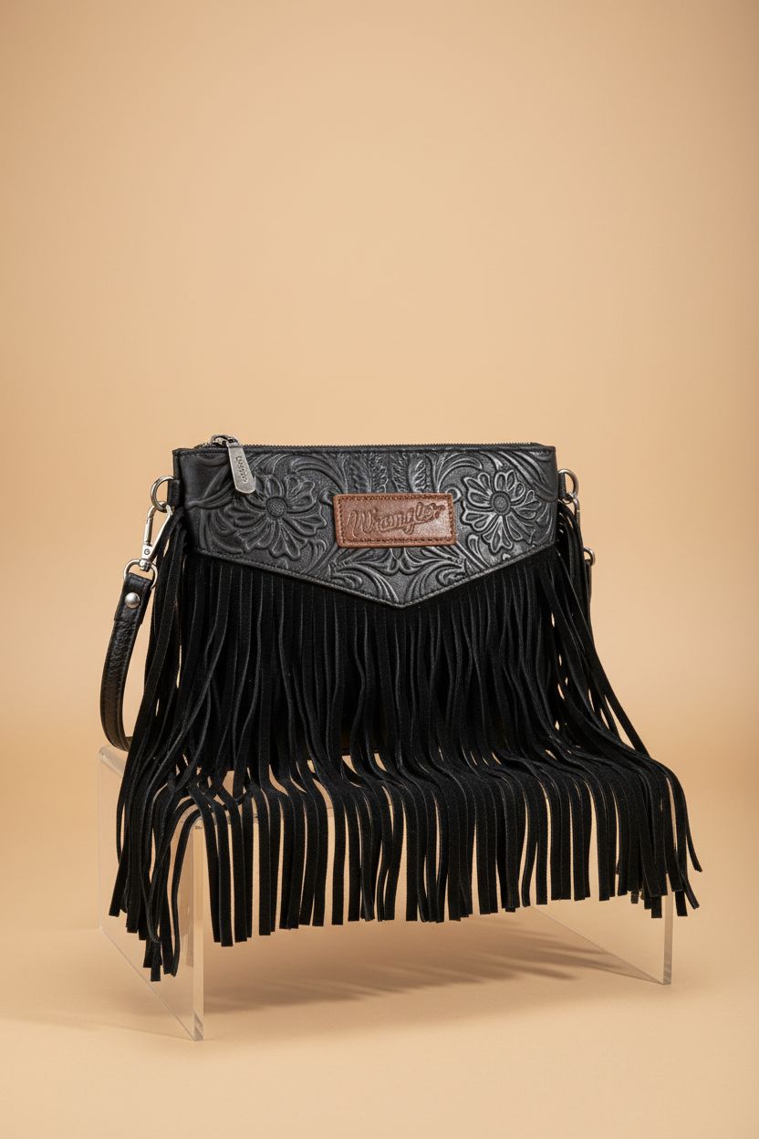 Close-up of Wrangler Clutch Wristlet Fringe Purse showcasing embossed floral detail and fringe