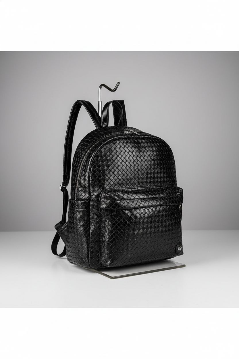 JINMANXUE black woven backpack purse on a studio backdrop, showcasing design details