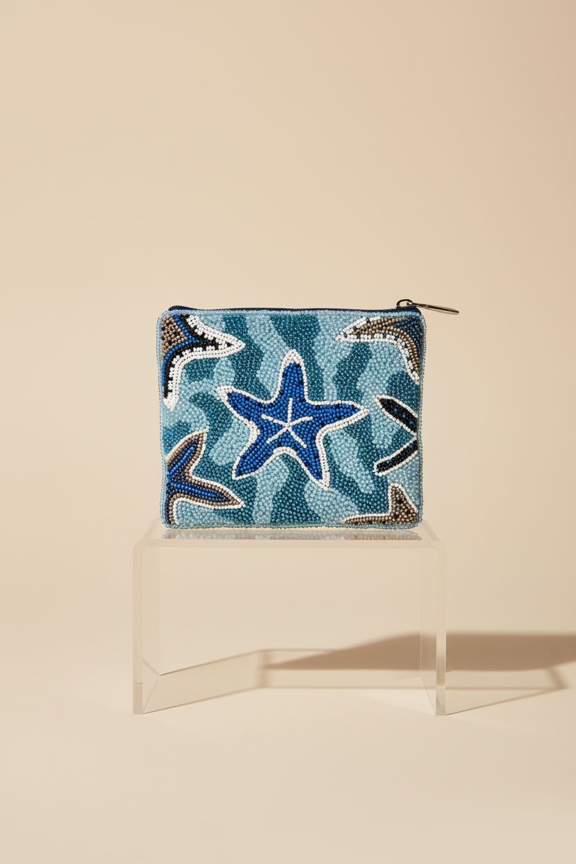 Close-up of the beaded starfish coin purse on a clear acrylic riser, Bamboo Trading