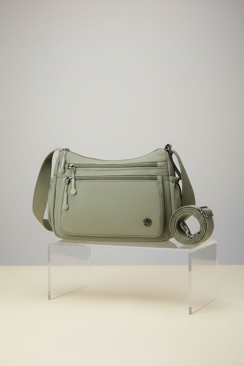 Wytidian green crossbody purse displayed in studio, showcasing its nylon texture and adjustable strap.
