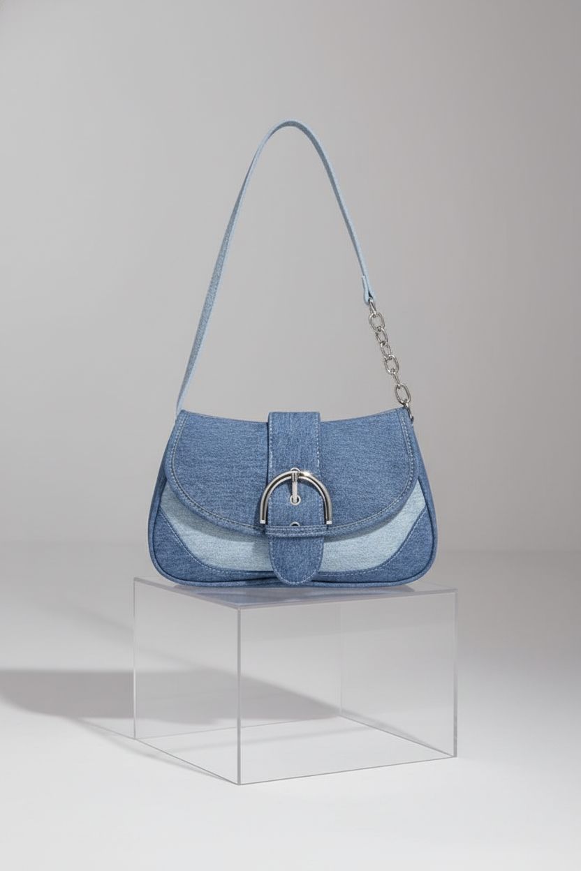 Close-up of Verdusa denim purse showcasing texture and colorblock details on a studio backdrop.