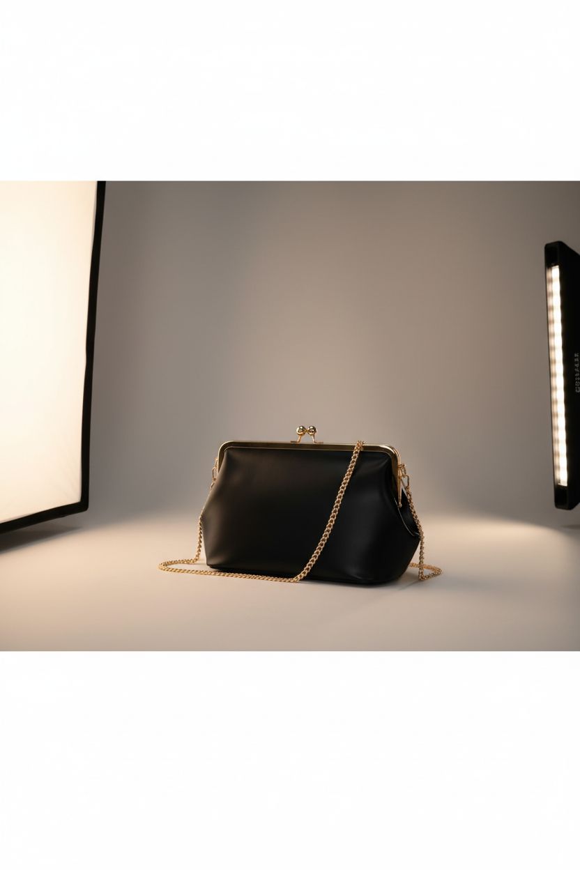 CATSEA kiss-lock handbag showcased in studio, highlighting its polished gold hardware.