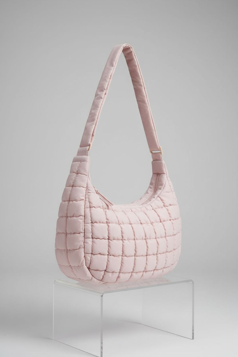 BAGSMART quilted crossbody bag showcased on acrylic pedestal, highlighting craftsmanship and design
