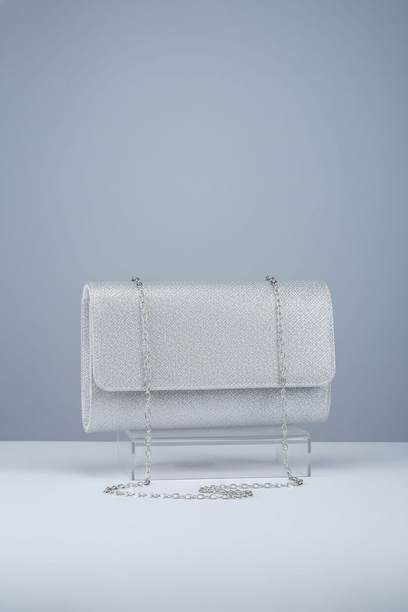 OSDUE silver envelope clutch showcasing its elegant design and glittery finish.