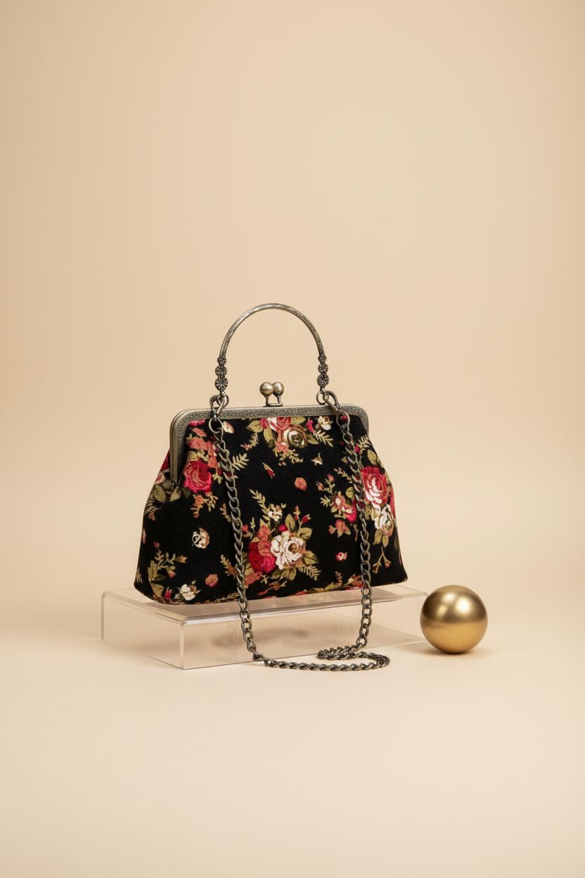 Abuyall kiss-lock purse showcased on a clear riser, highlighting its antique frame and floral fabric