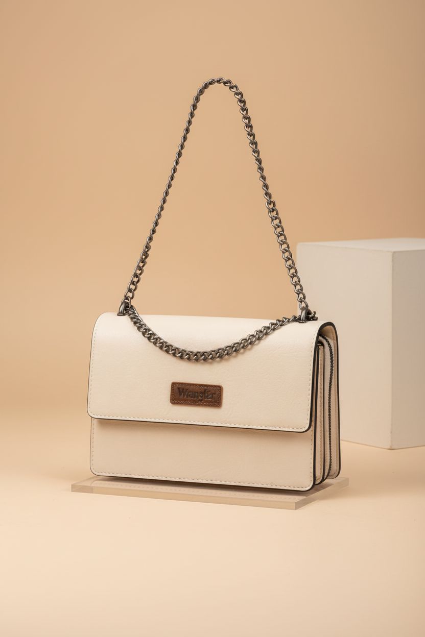 Detailed view of Wrangler western purse on an acrylic riser, highlighting craftsmanship.