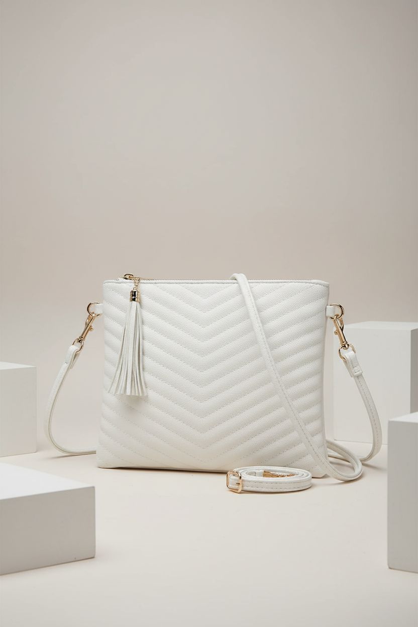 Product shot of CYHTWSDJ white crossbody purse showcasing vegan leather and tassel details.