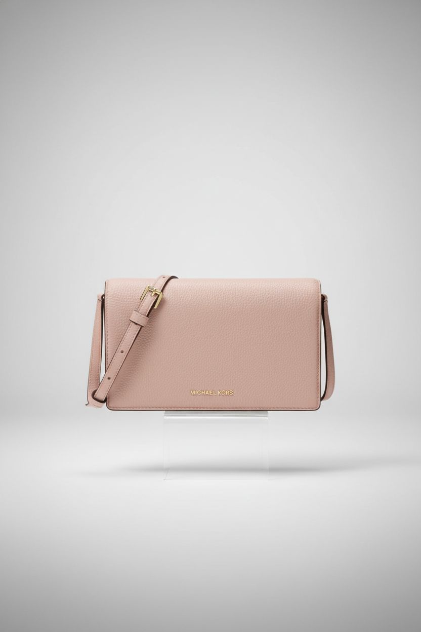 Michael Kors Jet Set Medium Flap Crossbody Bag showcased on an acrylic riser