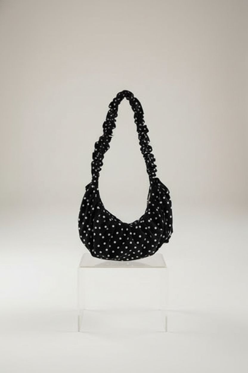 Product image of Halemet's polka dot bag highlighting its soft texture and design.