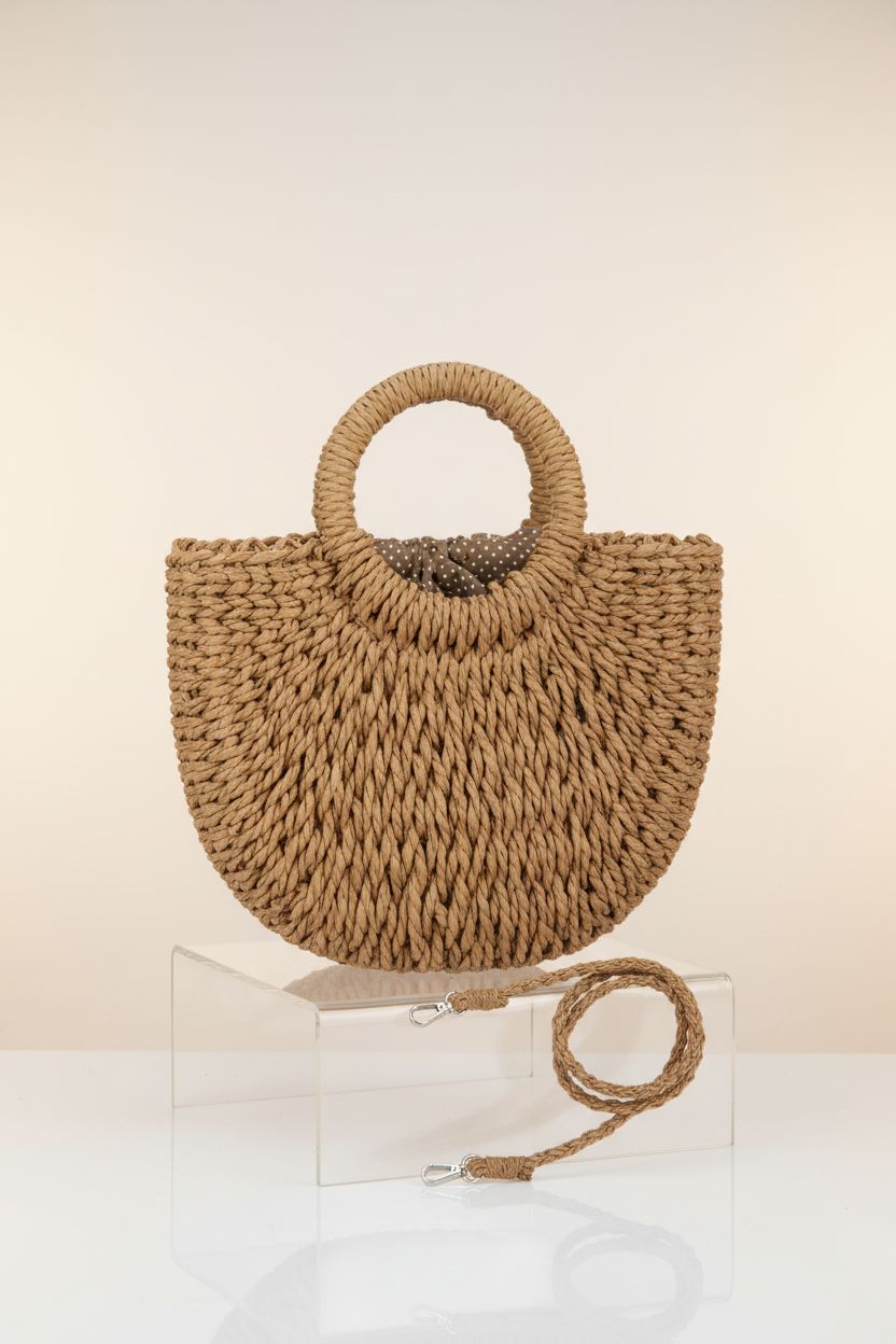 FENBEN rattan purse displayed in a studio, highlighting its craftsmanship and design.