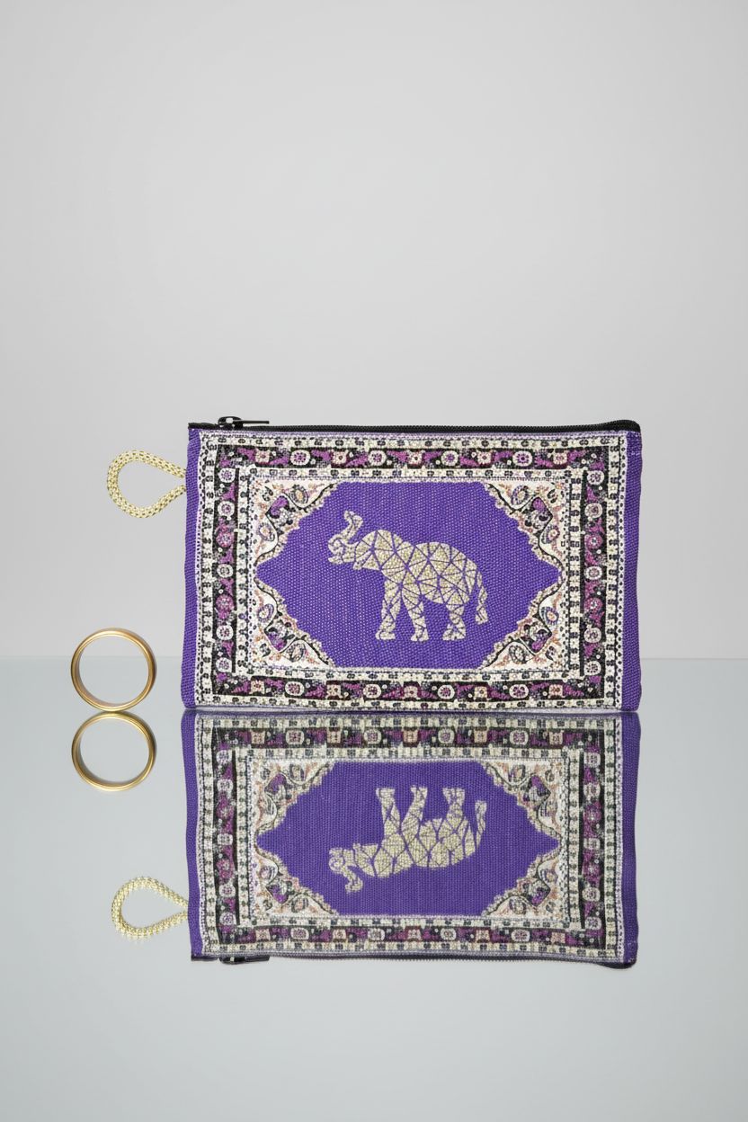 Close-up of BDM Turkish Elephant Purse, highlighting its embroidery and zipper details on a sleek backdrop.