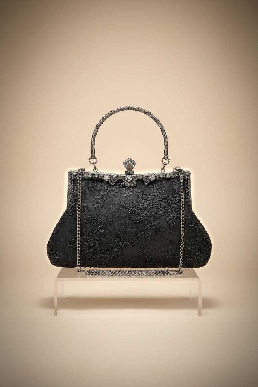 UBORSE black lace purse on acrylic riser highlighting intricate embroidery and clasp