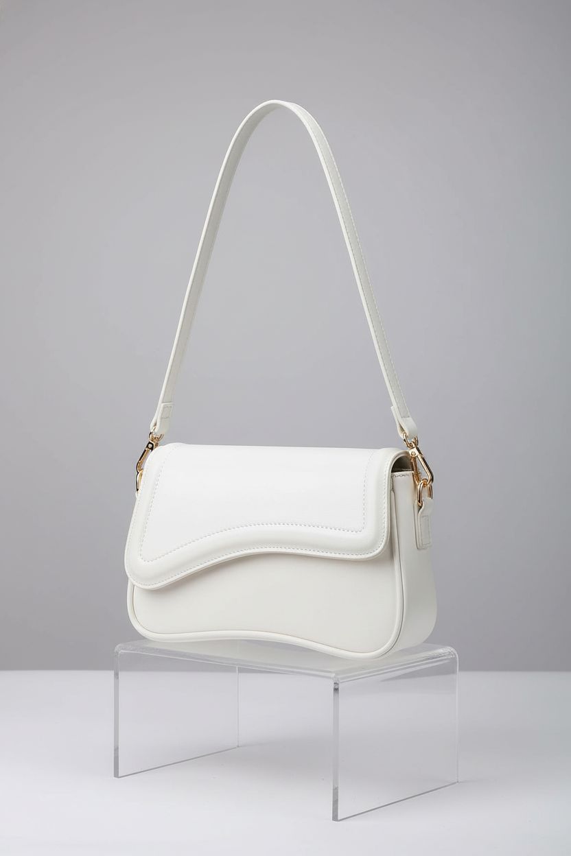KKXIU white purse on a gray backdrop, highlighting its detailed stitching and modern design.