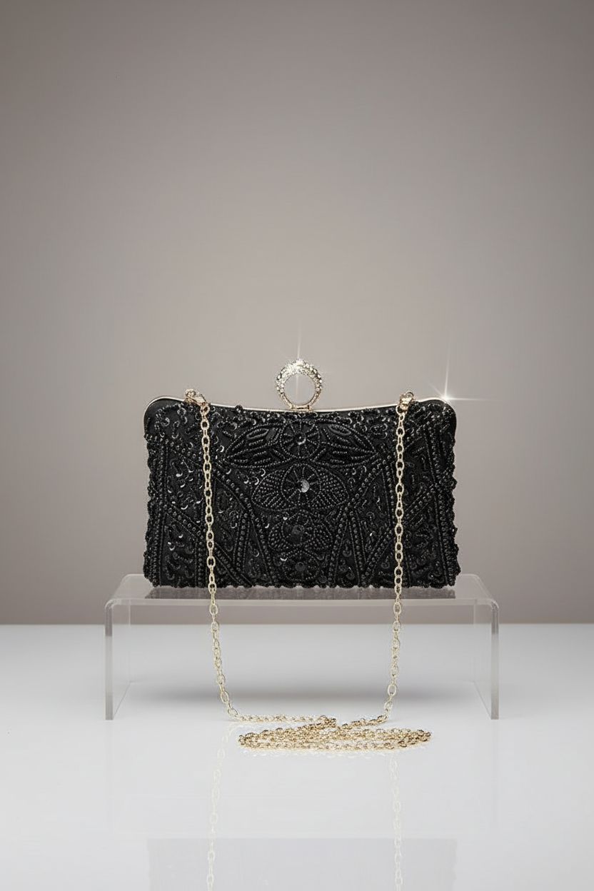Product shot of black beaded purse by BABEYOND on a warm gray backdrop.