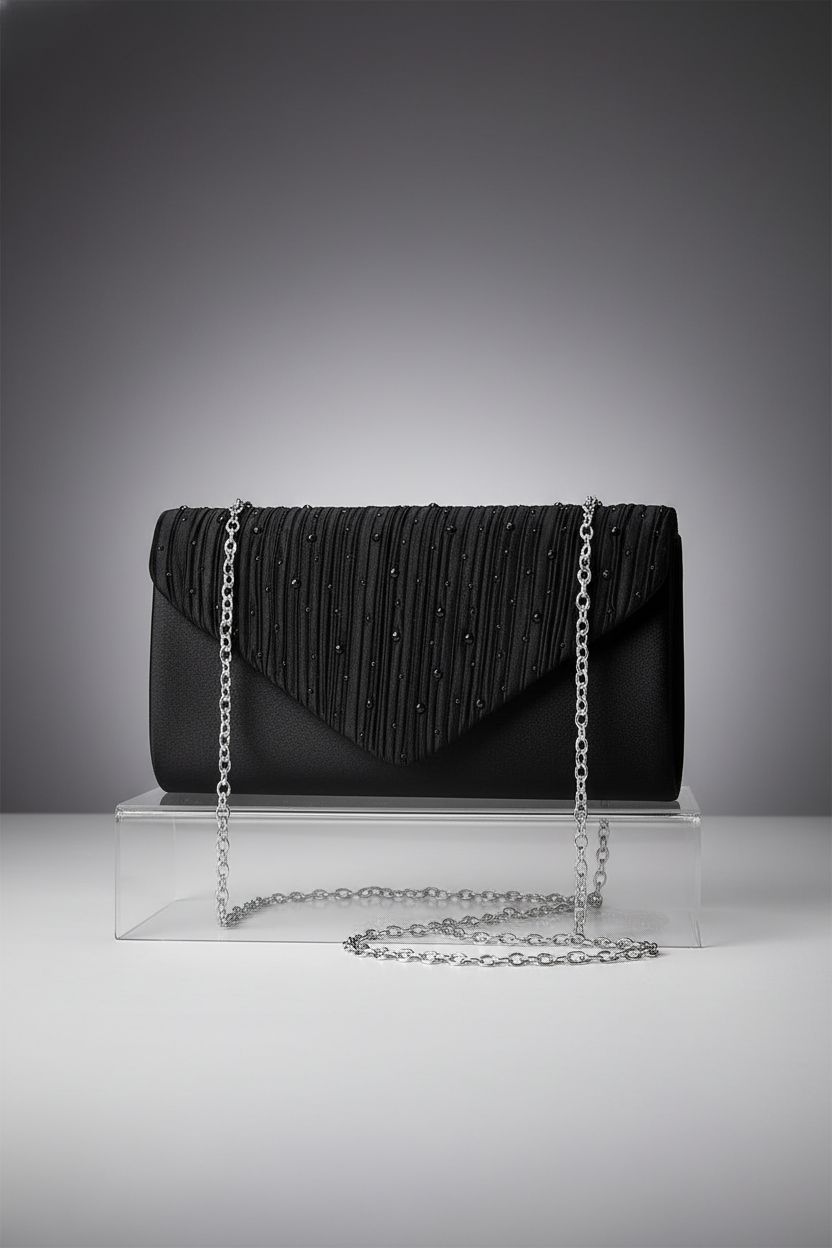 TINDTOP black satin bag with silver chain on a minimalist backdrop