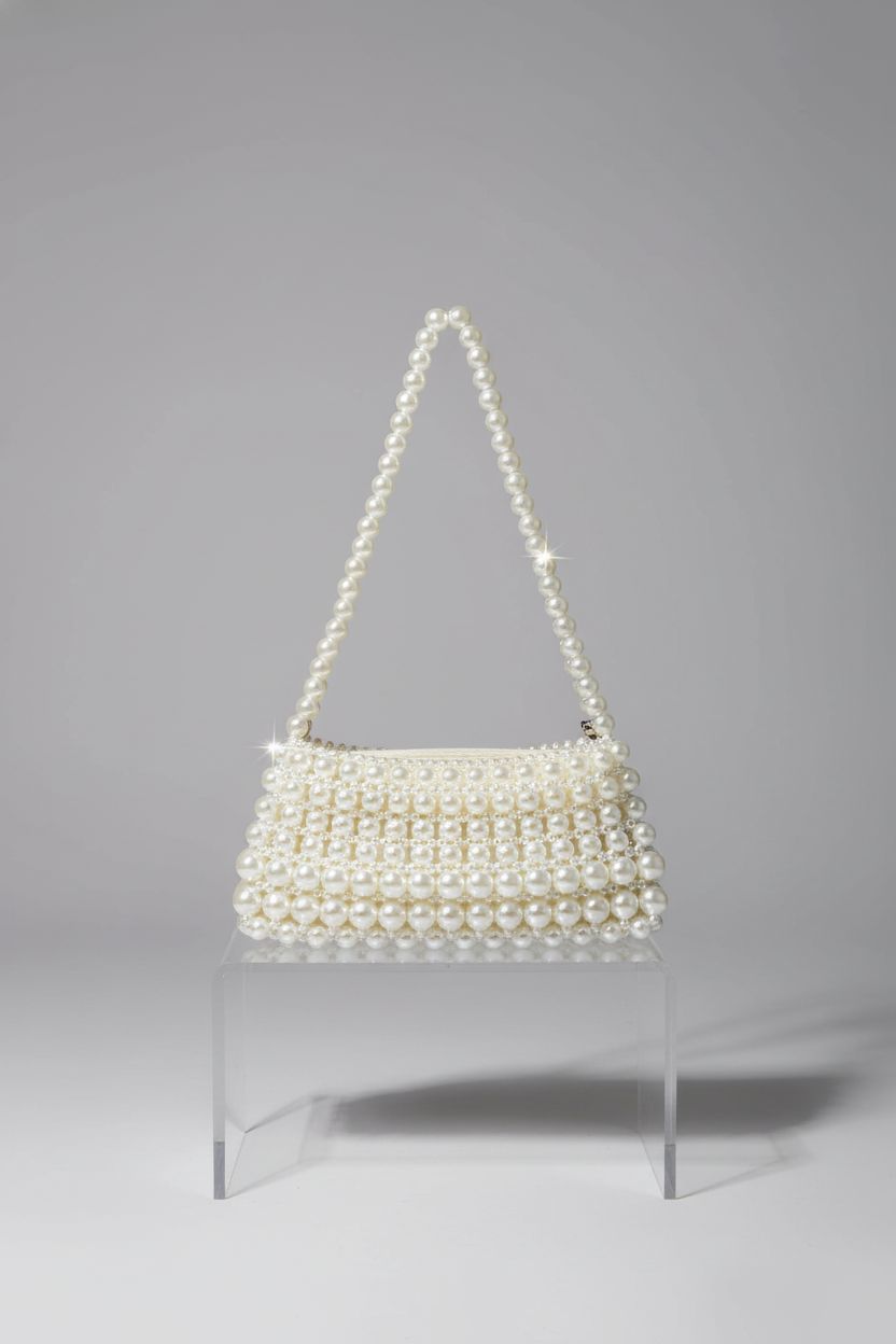 SHESRA Pearl Shoulder Bag showcased on acrylic riser with elegant lighting