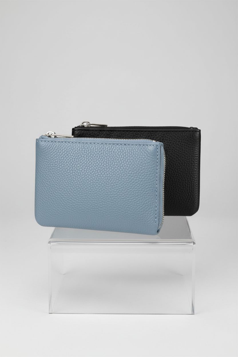 KALIONE black and blue PU leather coin purses displayed on an acrylic riser.