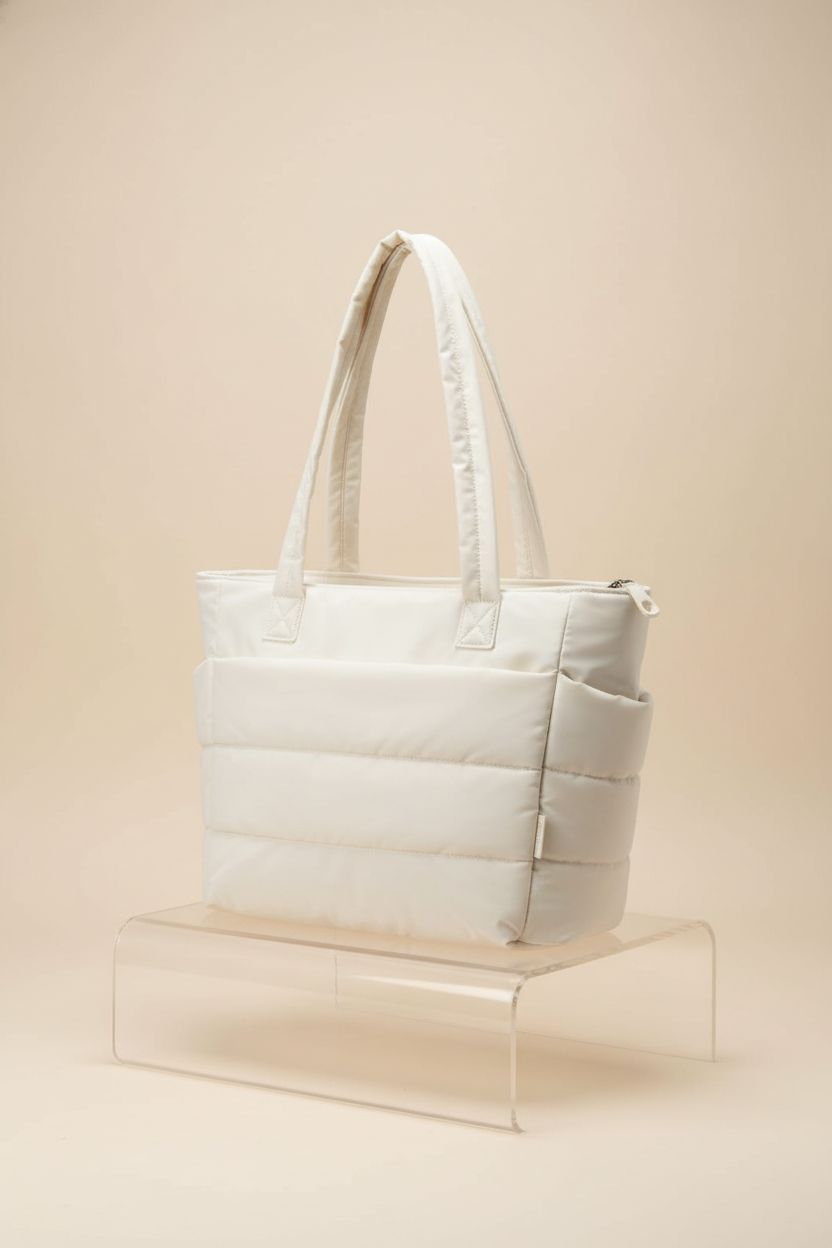 BAGSMART beige tote bag displayed on a minimal studio set showcasing its design and features.