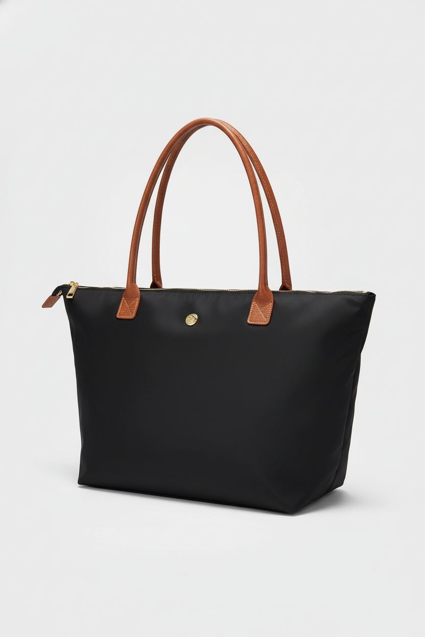 GM LIKKIE black nylon top handle bag showcased against a light-gray background; highlighting craftsmanship.