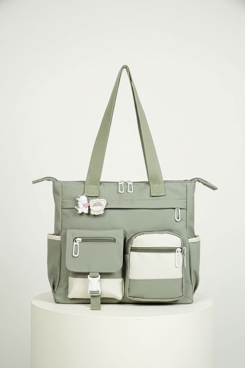 Elegant sage nylon Phaoullzon bag showcasing its design and craftsmanship on a clean backdrop.