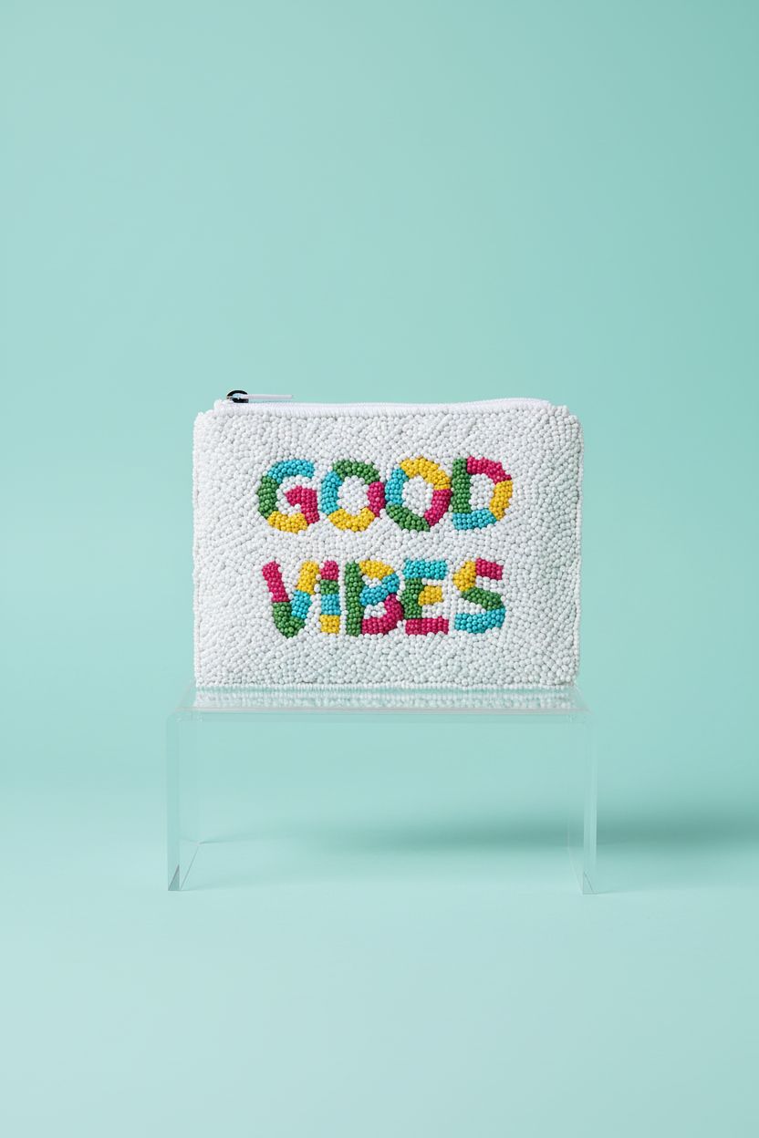 XOCARTIGE beaded coin purse showcased on a clean studio background, highlighting its quality.