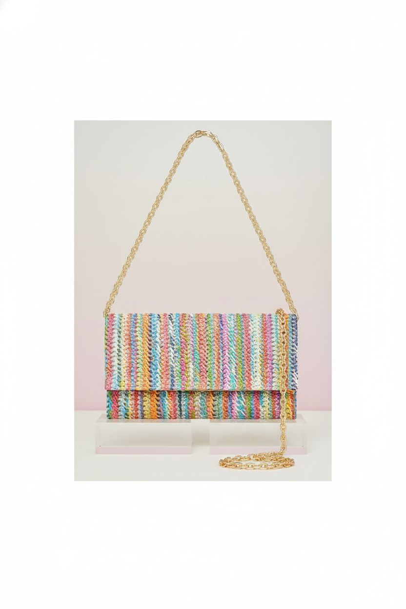 Kseymeir colorful envelope purse showcased on a pastel background, highlighting its raffia texture.