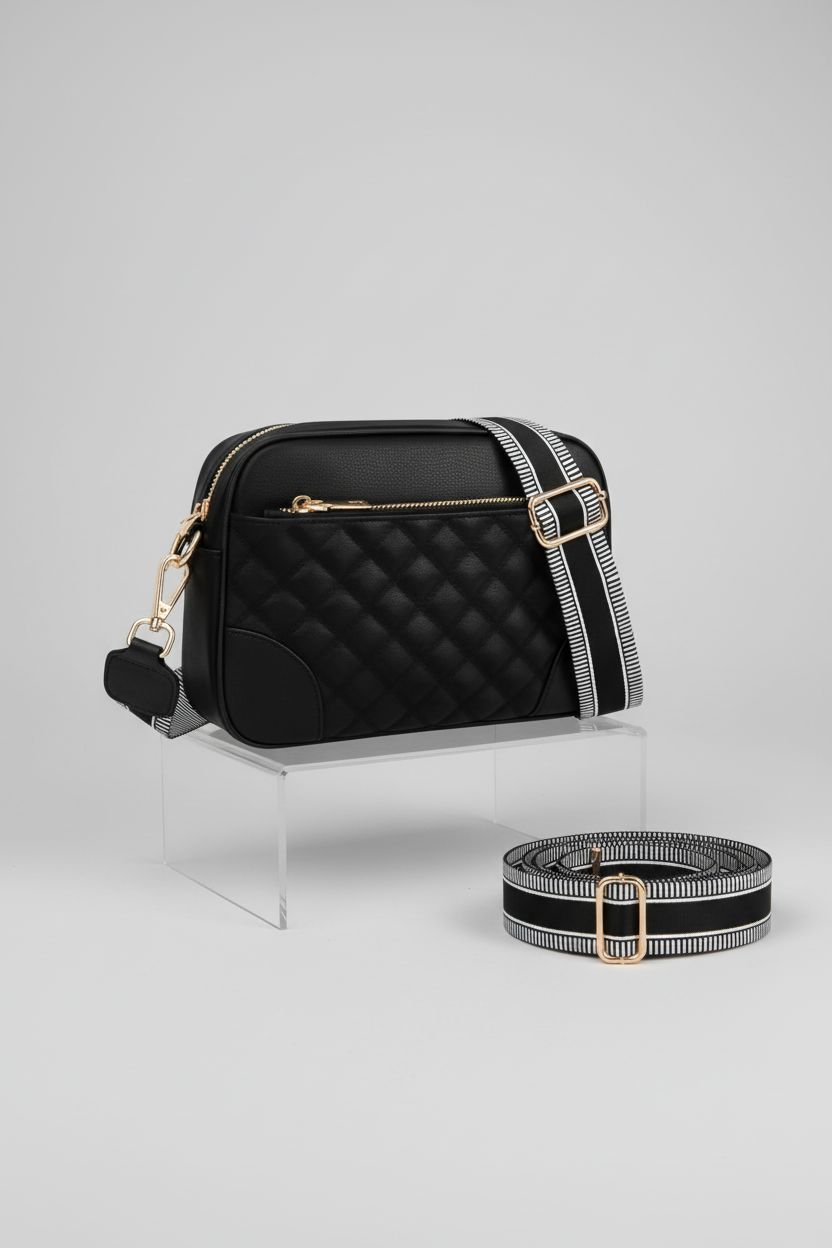 FYY Quilted Vegan Leather Crossbody Bag on display with changeable strap in studio lighting