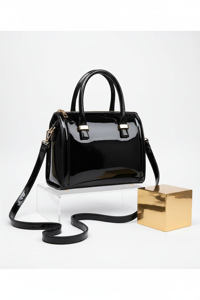 Dasein patent leather purse with gold hardware, showcasing its glossy finish on a clean studio backdrop.