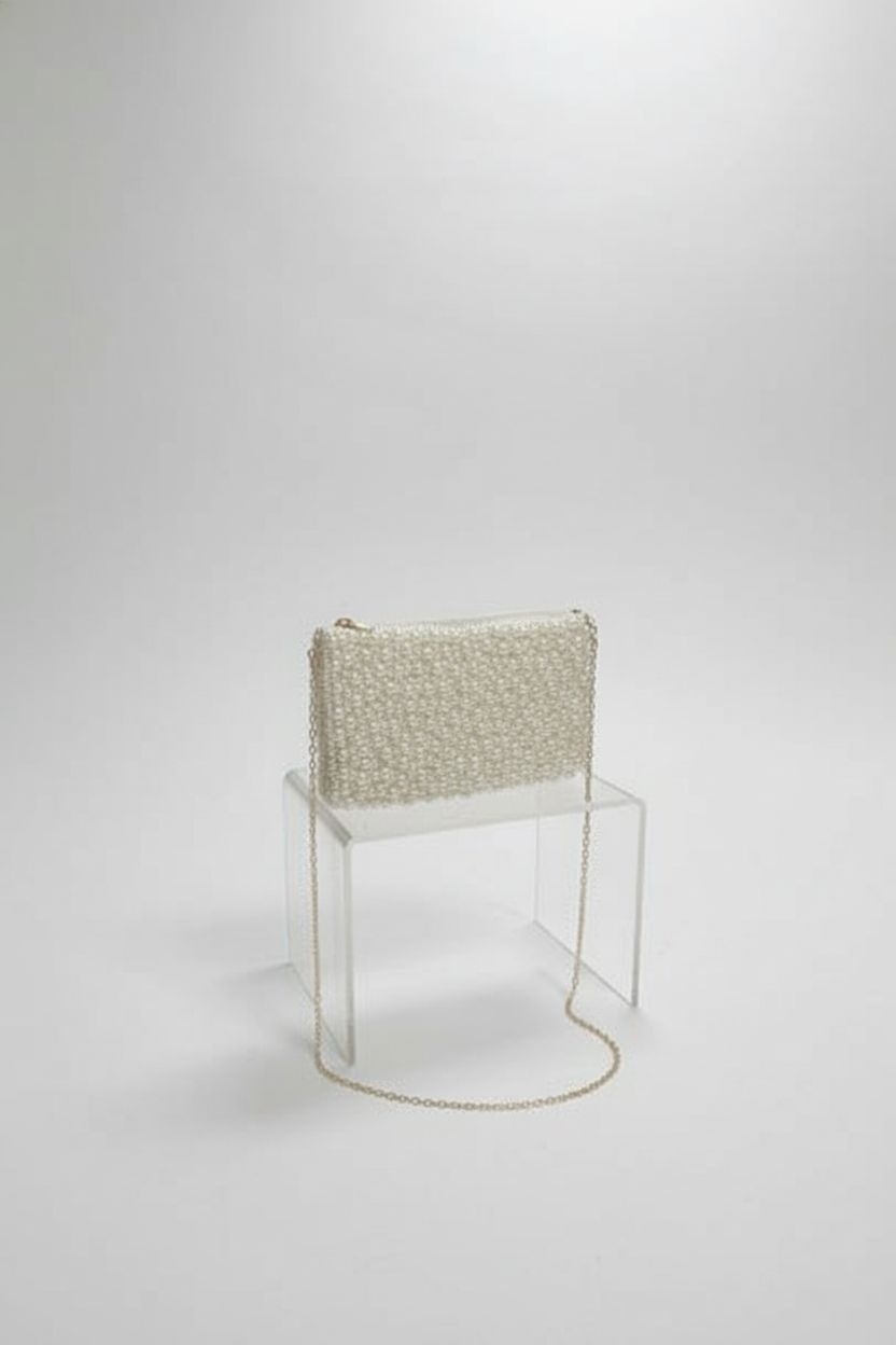 Geiomoo pearl shoulder bag showcased on a clean studio set, highlighting exquisite craftsmanship.