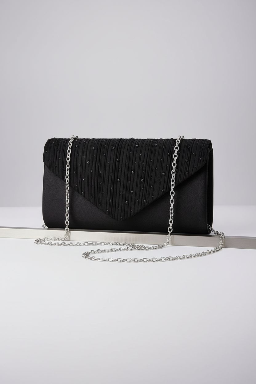 TINDTOP black envelope clutch displayed on a gray background, highlighting its sleek design and satin texture.