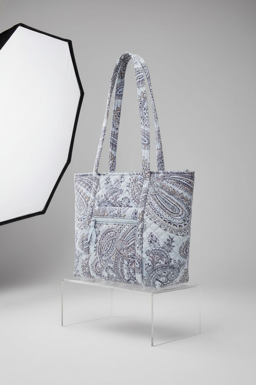 Vera Bradley's Soft Sky Paisley Tote Bag showcased on a seamless backdrop, highlighting its elegant design.
