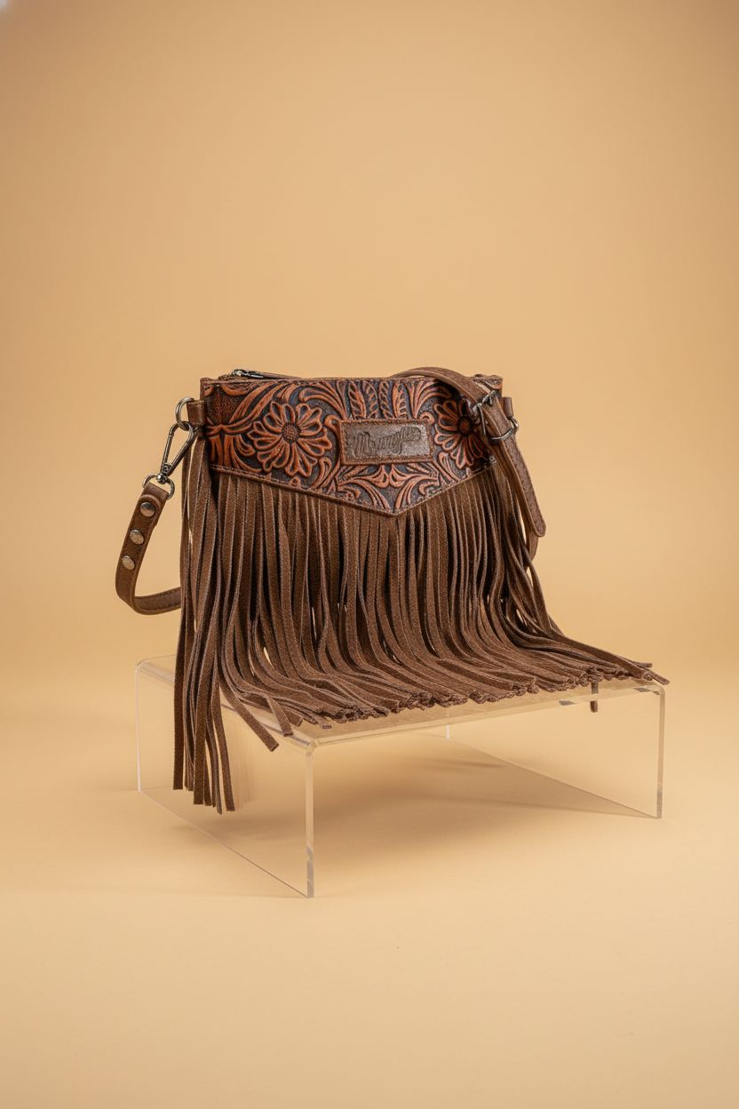Detailed view of Montana West Wrangler Clutch Wristlet Fringe Purse on a seamless background
