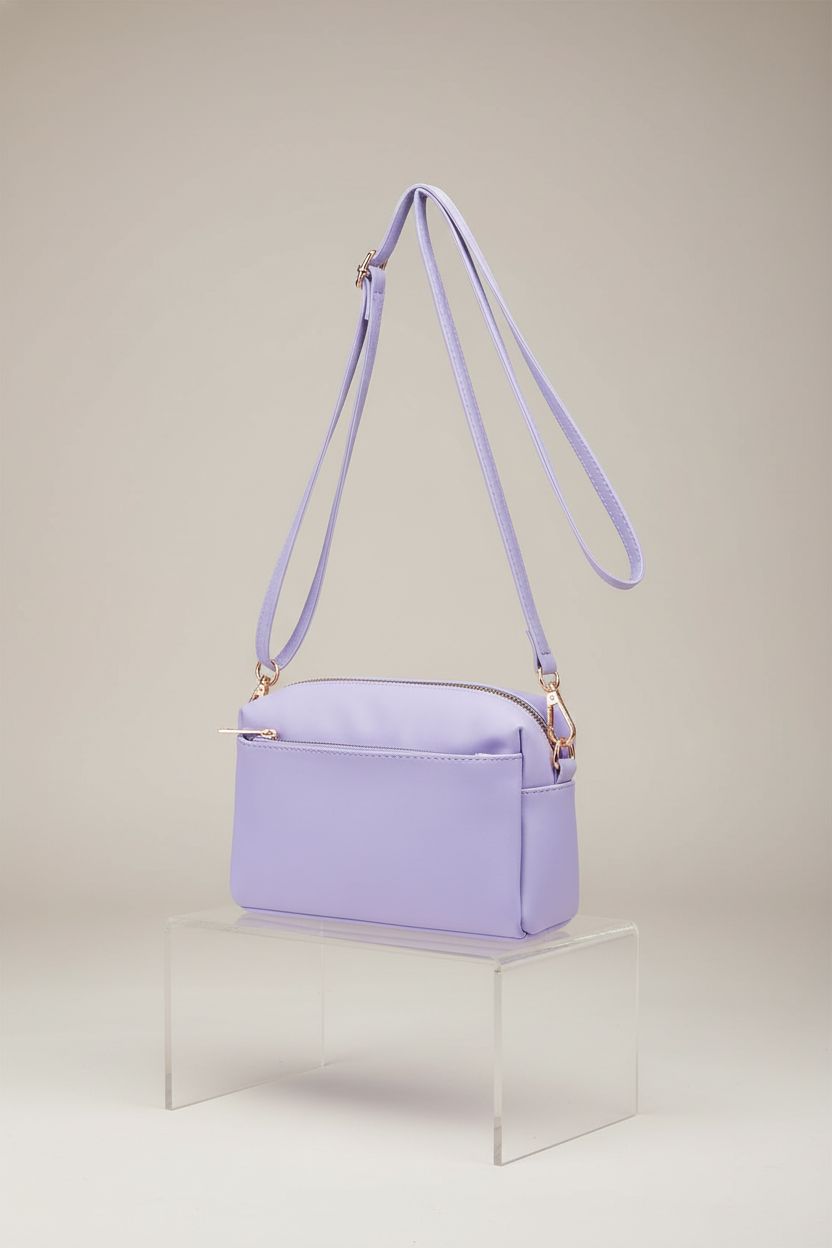 VOROLO lavender crossbody bag displayed on a minimal backdrop, showcasing design