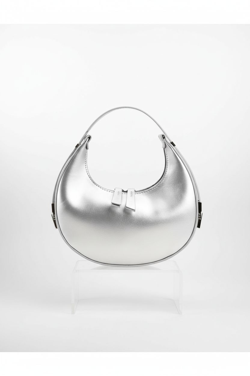 Sophisticated silver FantasyBear purse on a light backdrop, highlighting its design and double zipper feature.