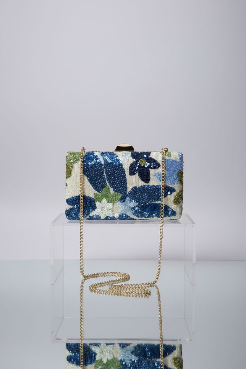QWINEE mini beaded clutch showcasing floral embroidery and gold clasp design.