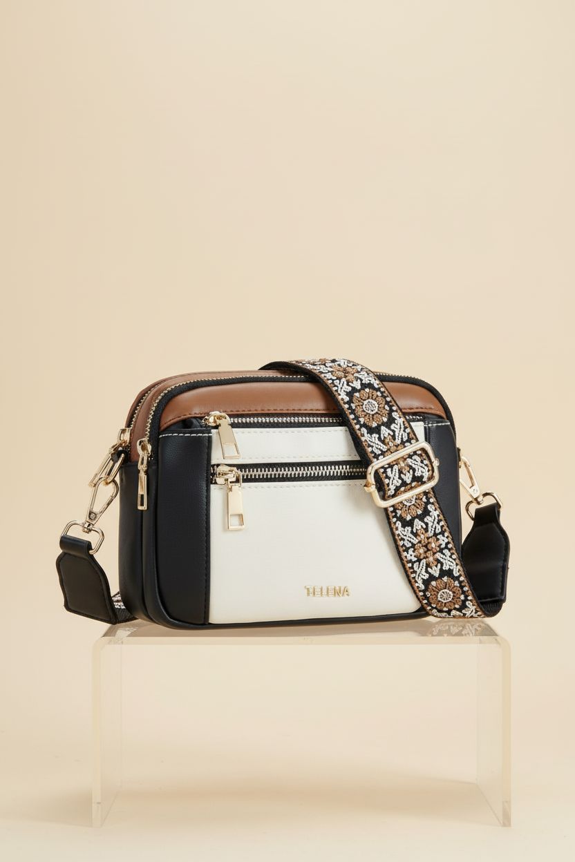 Telena vegan crossbody bag on an ecru backdrop, emphasizing its craftsmanship and stylish design.