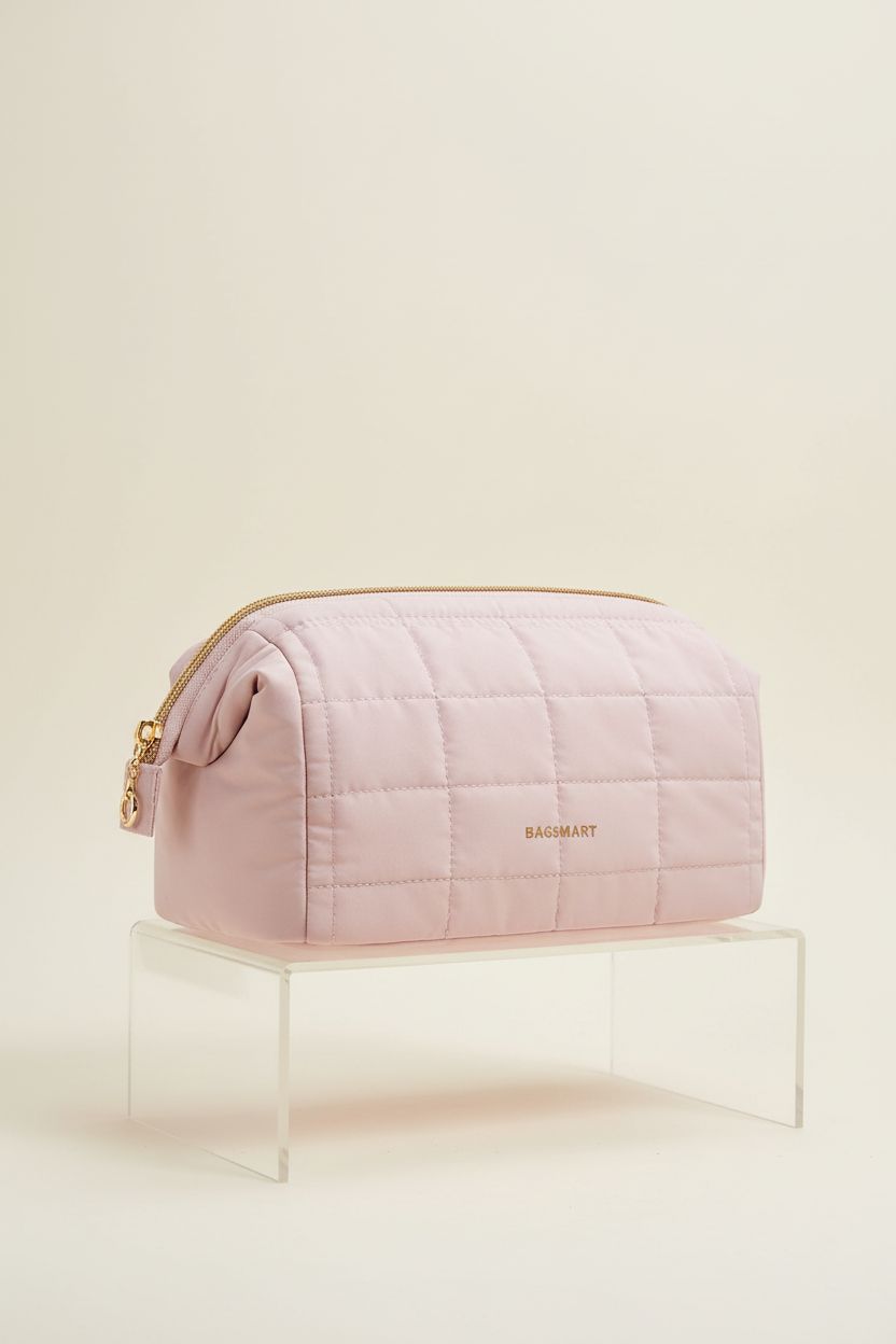 BAGSMART blush bag showcasing its quilted texture and gold zipper on display.
