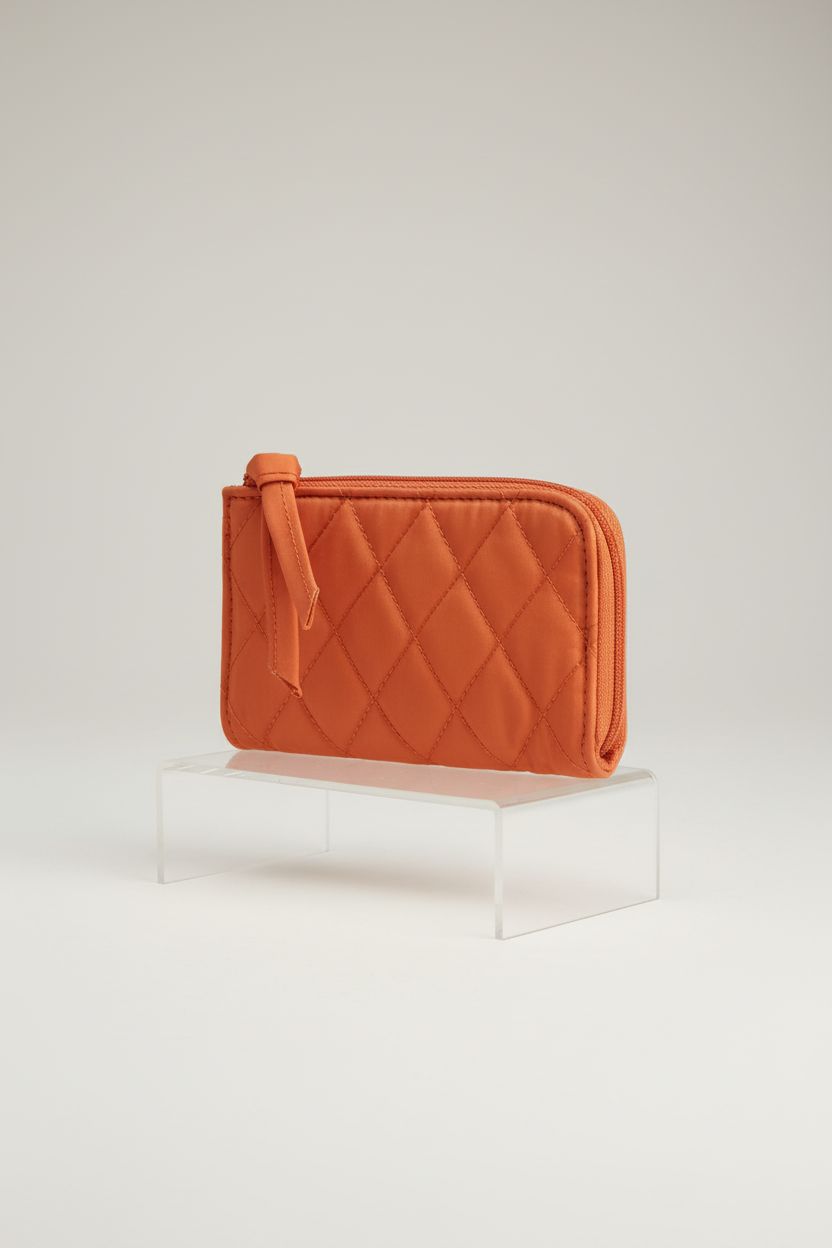 Vera Bradley koi orange quilted pouch showcasing its detailed design