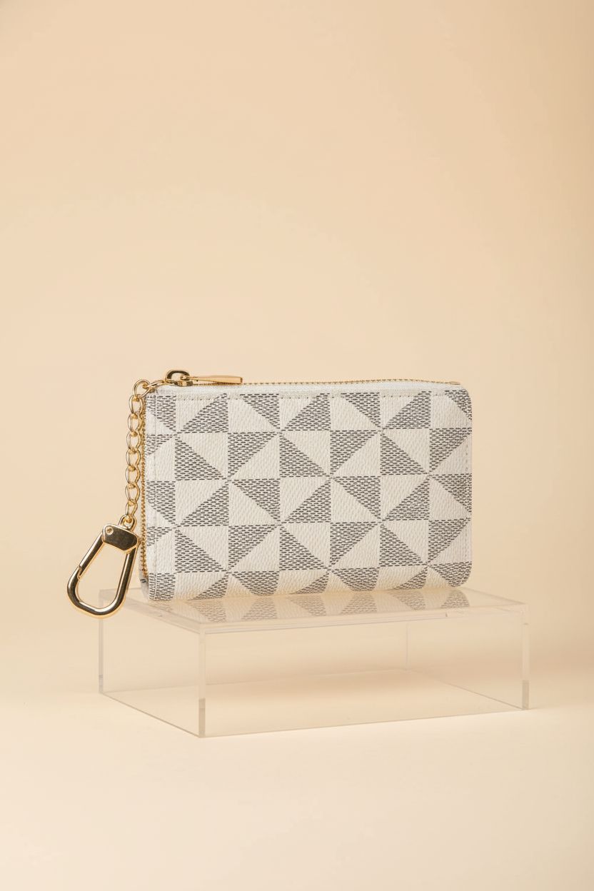 FOUSIVOU designer keychain wallet displayed on a clear riser to highlight its quality and design.