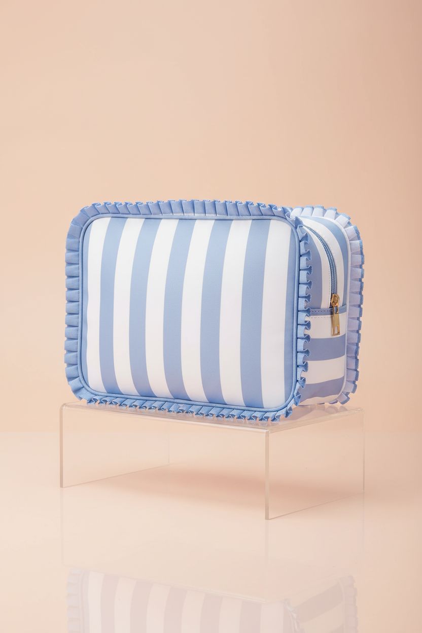 Fozira nylon makeup pouch on acrylic riser, showcasing its lace edge and craftsmanship in a studio setting.