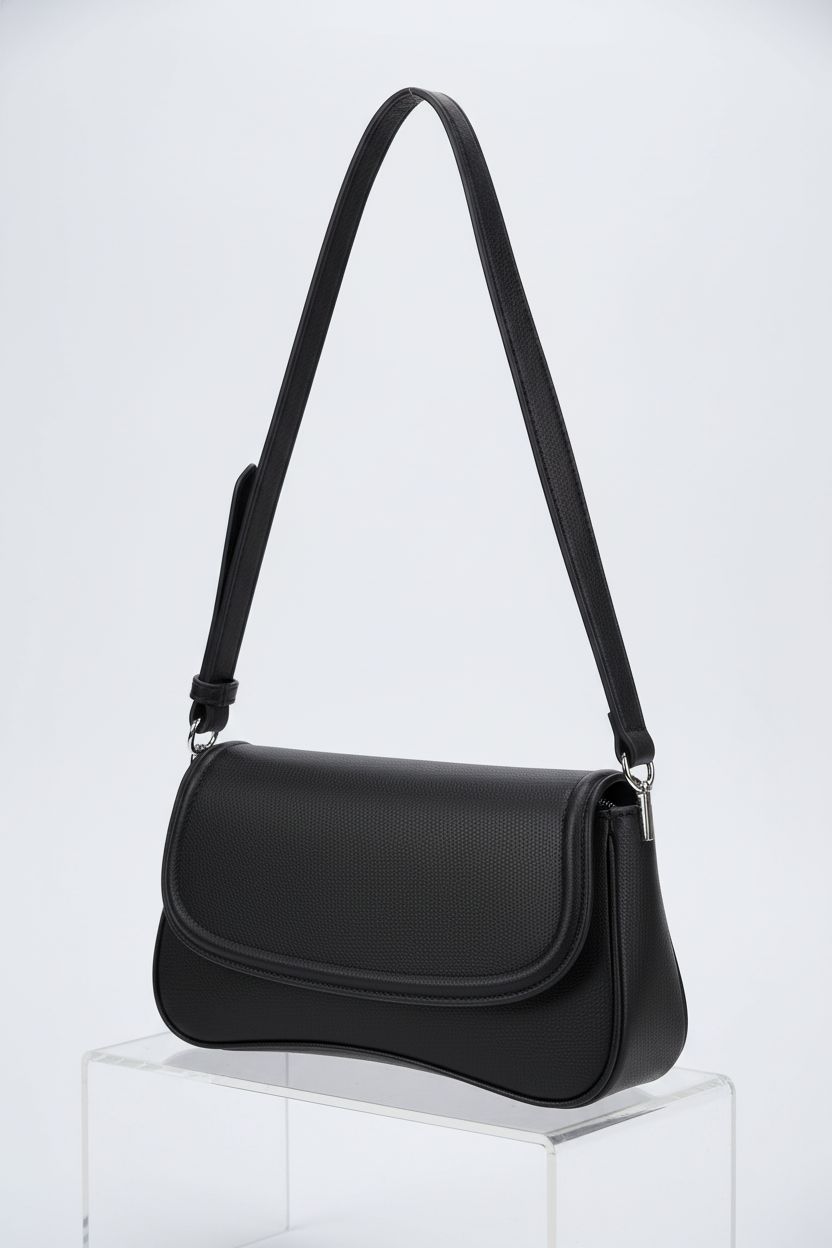 Product shot of EVVE small shoulder bag on a gray backdrop, showcasing silver hardware and design details.