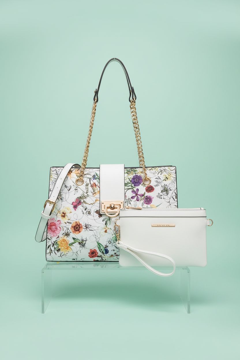 Dasein white floral tote and clutch displayed on a pastel mint backdrop, showcasing their details